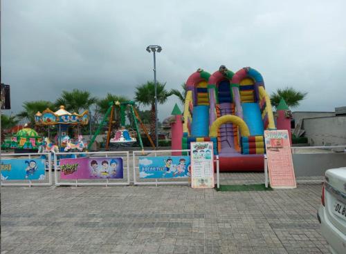 a playground with a water park with a roller coaster at Mannat Haveli in Kurukshetra