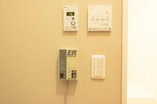 an exit sign on a wall with an er on it at Woodhouse Yasunaya in Lake Toya