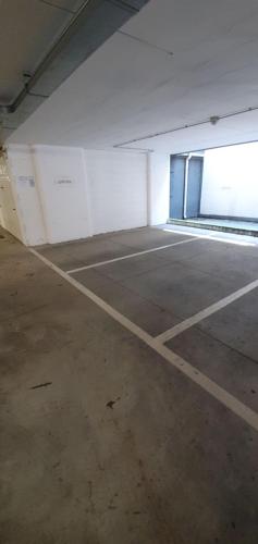 an empty parking lot with a large door in a building at Bardoliners in Bardolino