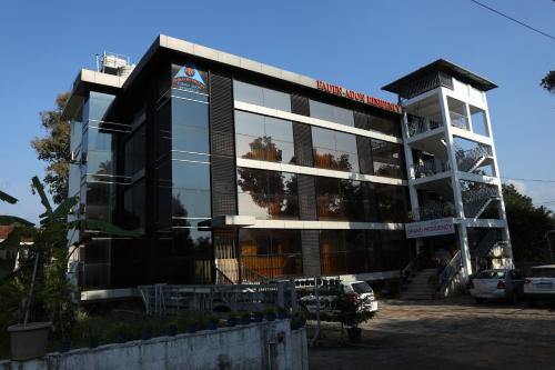 a large building with a lot of windows at Airport Cochin Grand Residency , NEDUMBASSERY in Angamaly
