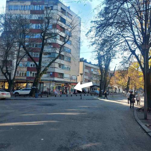 a street in a city with a large building at APARTMAN POZORISTE Penthaus in Banja Luka