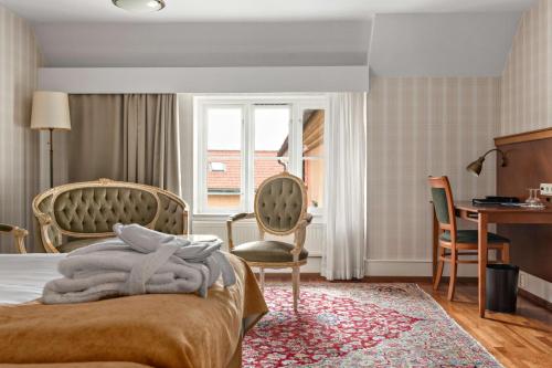 Un ou plusieurs lits dans un hébergement de l'établissement Best Western Strand Hotel