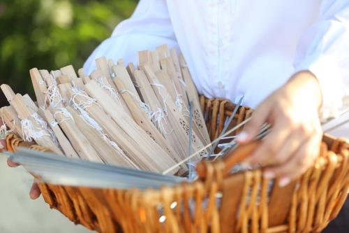 a person holding a basket filled with wooden sticks at Sava Salinas in Las Salinas