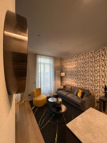 a living room with a couch and a table at GLI EQUILIBRISTI in Cuneo