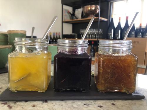 a group of three jars of honey on a counter at Tempel Wines in Paarl