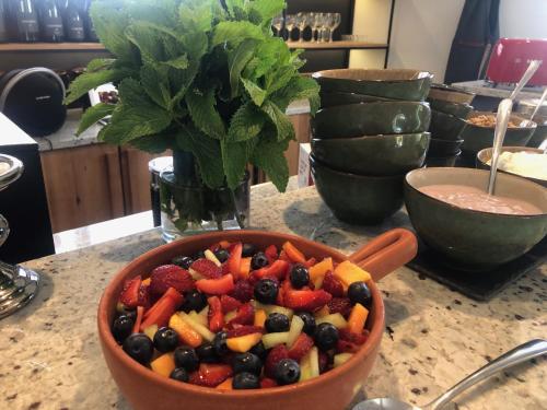 a bowl of fruit and vegetables on a counter at Tempel Wines in Paarl