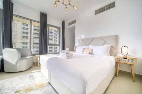 29 Boulevard, Burj Khalifa Downtown Dubai - Mint Stay tesisinde bir odada yatak veya yataklar