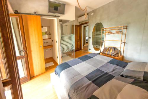 a bedroom with a large bed and a mirror at Chalet Bornhome CIR O17022 in Borno