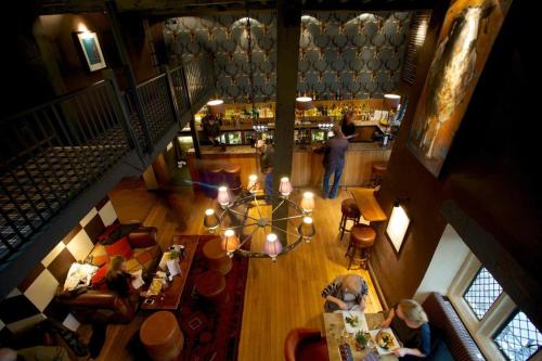 an overhead view of a bar with people sitting at tables at The Broadway Hotel in Broadway