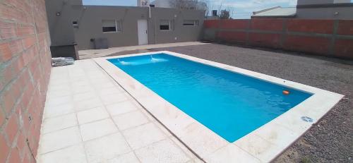 a swimming pool on the side of a building at El Bambino in Puerto Madryn