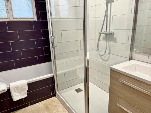 a bathroom with a shower and a sink at Le parc de Gouts in Aiguillon