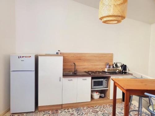 Кухня або міні-кухня у Appartement en Duplex