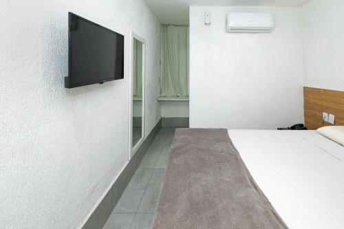 TV a/nebo společenská místnost v ubytování Yak Beach Hotel Natal