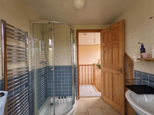 a bathroom with a shower and a tub and a sink at *Large Unique Retro Private Attic & Bathroom* in Brighton & Hove