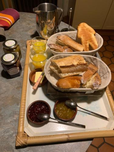 a table topped with two plates of sandwiches and dips at Authenticité et Sérénité in Obernai