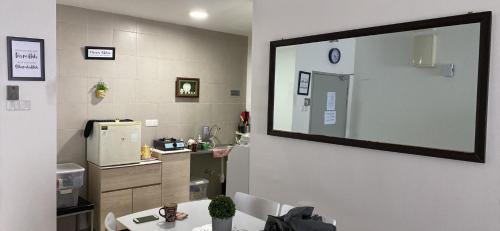 a room with a large mirror on a wall at SKF Homestay in Puchong