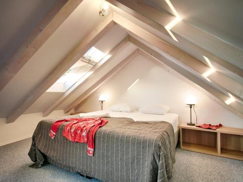 a bedroom with a bed in an attic at Villa Zdenka in Vis