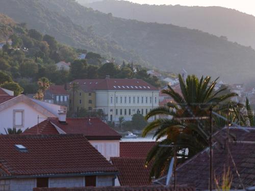 a view of a city with houses and a mountain at Villa Zdenka in Vis