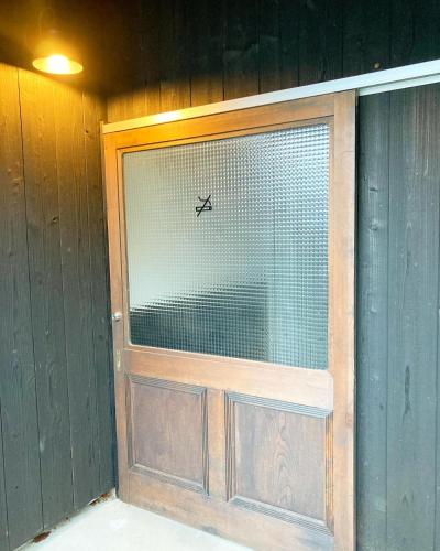 a door with a window with a plane on it at ENSO Residence 古民家一棟貸切宿 東近江市五個荘 ペット可 定員6名 in Higashiomi