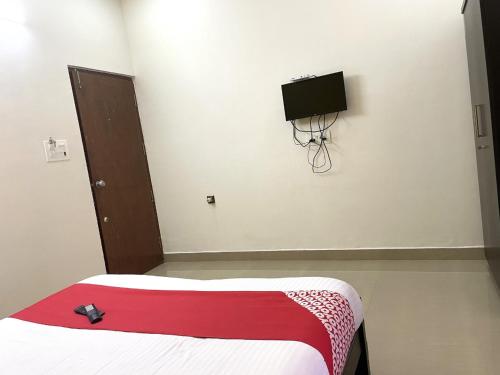 Postel nebo postele na pokoji v ubytování Green Valley Residency