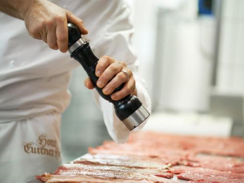 a chef preparing food on top of a table at Eurener Hof in Trier