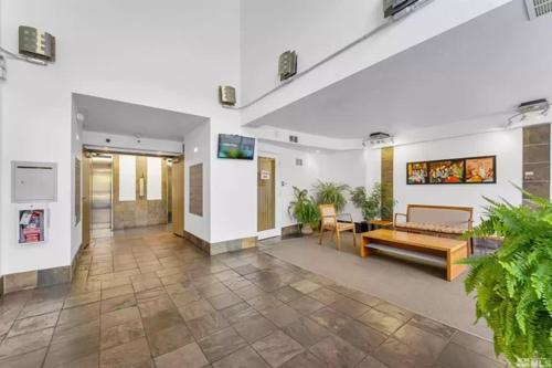 a lobby with a couch and a table in a building at Panorama Place in Reno