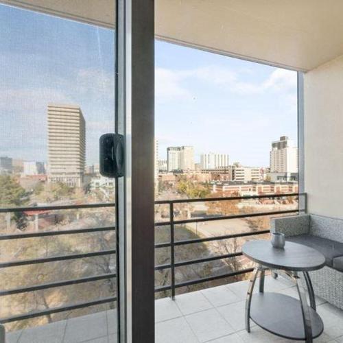 a balcony with a table and a view of a city at Panorama Place in Reno