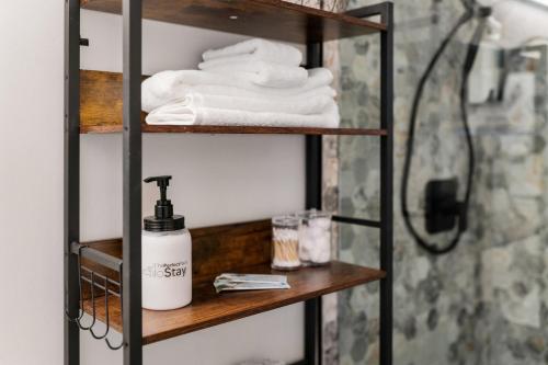 a shelf with towels and a shower in a bathroom at Panorama Place in Reno