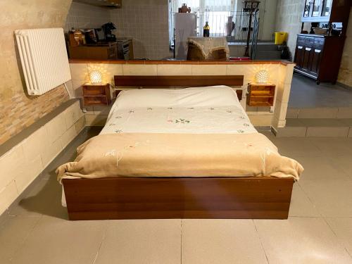 Кровать или кровати в номере La perla di tufo