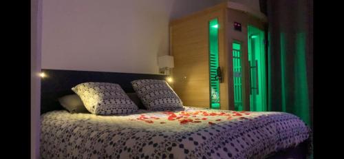 a bedroom with a bed with flowers on it at Suite pour les Amoureux_Val d'Europe Disney in Coupvray