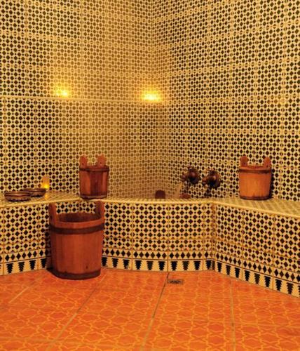 a bathroom with a bunch of toilets in a room at Perla Hôtel in Fès