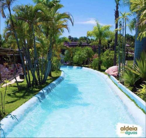 Der Swimmingpool an oder in der Nähe von Flat Village - Aldeia das águas