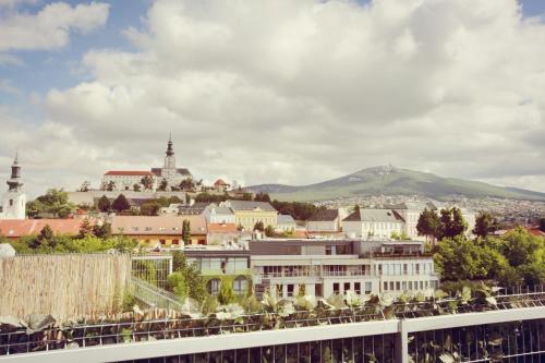 a view of a city from the roof of a building at City Hotel Nitra with free parking in Nitra
