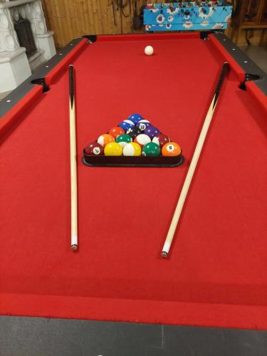 a snooker table with a pile of balls on it at Hotel Panorama in Mosonmagyaróvár
