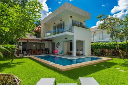 a house with a swimming pool in the yard at Luxury Private 3BED Villa, Garden, Pool,Security in Tulum