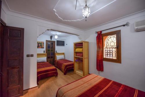 Postel nebo postele na pokoji v ubytování Riad Assia
