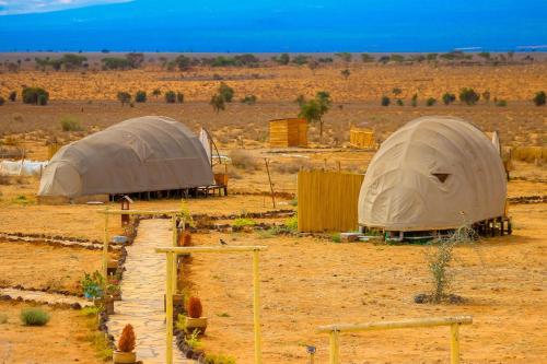 two tents in the middle of the desert at Amanya 1-Bed Elephant Suite Tent in Amboseli