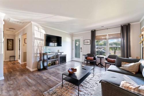 a living room with a couch and a table at Reno Roost in Reno