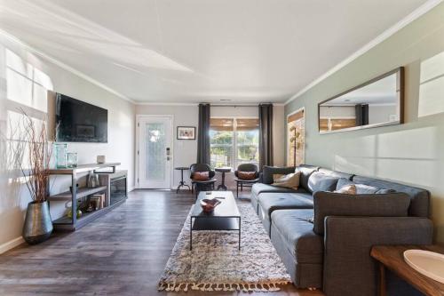 a living room with a couch and a table at Reno Roost in Reno