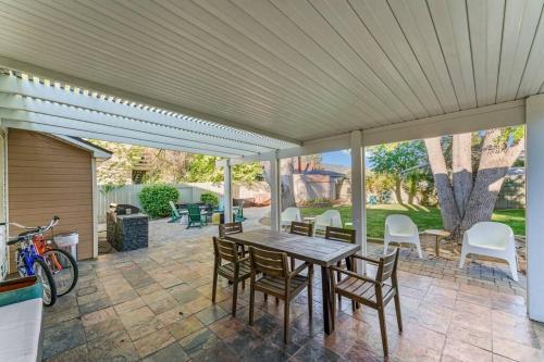 a patio with a wooden table and chairs at Reno Roost in Reno