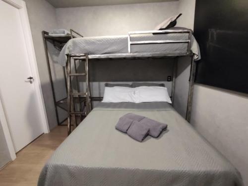 Giường trong phòng chung tại Studio 17 Moov Brás - 100 metros Metrô