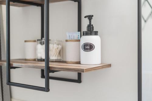 a shelf with a soap dispenser on it at Reno Roost in Reno
