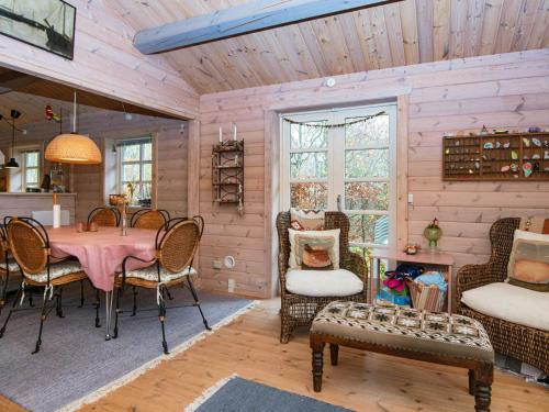 a dining room with a pink table and chairs at 4 person holiday home in Glesborg-By Traum in Glesborg