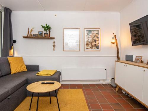 a living room with a couch and a table at 4 person holiday home in Fanø-By Traum in Fanø
