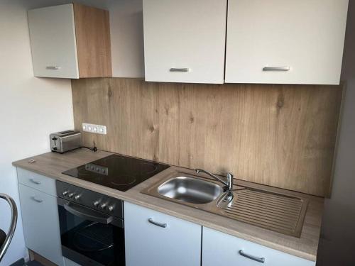 A kitchen or kitchenette at Tower View Apartment