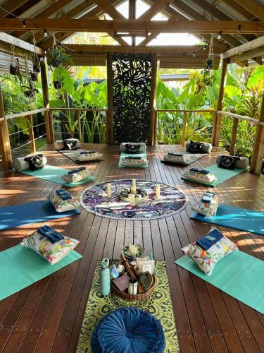 a wooden deck with a table with candles on it at The Palms At Palm Cove in Palm Cove