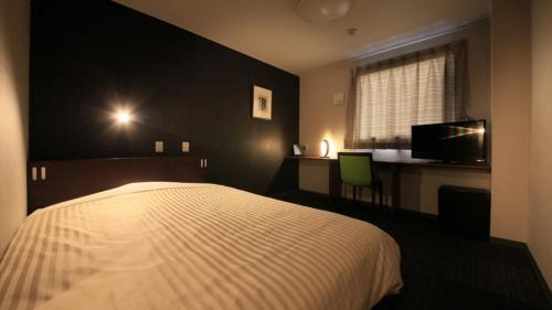 Postel nebo postele na pokoji v ubytování Hotel Coonel Inn