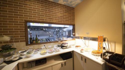 Una cocina o zona de cocina en Hotel Coonel Inn