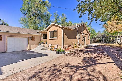 a house with a driveway and a garage at Westside Large Home in Colorado Springs