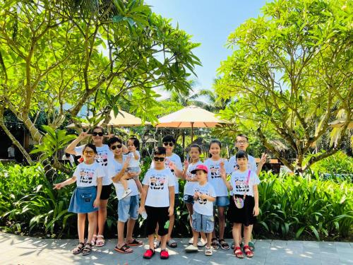 a group of children posing for a picture at a resort at Hoi An Eco Lodge & Spa in Hoi An